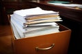 pile of divorce papers stuffed in a file cabinet