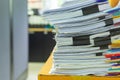 Pile of documents on desk stack up high waiting to be managed Royalty Free Stock Photo