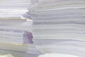 Pile of documents on desk stack up high waiting to be managed Royalty Free Stock Photo