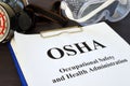 Documents with Occupational Safety and Health Administration OSHA. Royalty Free Stock Photo