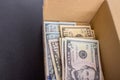 A pile of dollar bills lying in a box Royalty Free Stock Photo