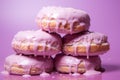 a pile of donuts on a purple background