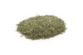 Pile of dried basil spice isolated