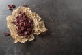A pile of dried beef jerky pieces on paper and cutting board Royalty Free Stock Photo