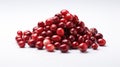 A pile of dried cranberries on a white surface