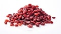 A pile of dried cranberries on a white surface