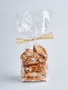 Pile of dried fruits Biscotti Cantucci Biscuits Cookies in plastic wrap packaging for sale. Italian dessert cookies close up, Royalty Free Stock Photo