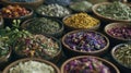 A pile of dried herbs and flowers neatly arranged in small bowls and jars. Each ingredient has a different purpose in Royalty Free Stock Photo