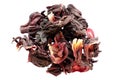 Pile of dried karkade flowers isolated on white background, top view. Red aromatic hibiscus tea. Dry tea leaves hibiscus