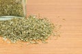 Pile of dried parsley with glass jar Royalty Free Stock Photo