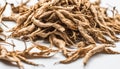 A pile of dried plant roots on a white surface