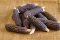 Dried purple corn on a rustic table