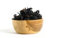 Pile of dried Rosella flower  Hibiscus sabdariffa  in a wooden bowl isolated on white background Royalty Free Stock Photo