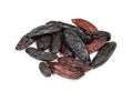 Pile of dried tonka beans closeup on white