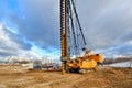 Pile driving machine on a construction site Royalty Free Stock Photo