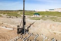 Pile driving machine. Diesel hammer pile driving machine working on construction site. Preparation of the pile foundation for the Royalty Free Stock Photo