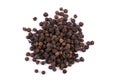 A pile of a dry black pepper seeds isolated on white Royalty Free Stock Photo