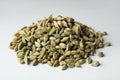 Pile of dry cardamom pods on light table Royalty Free Stock Photo