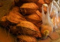 Pile of dry coconuts for sale outside a Hindu temple