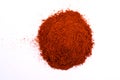 A pile of a dry red paprika powder isolated on white Royalty Free Stock Photo