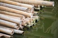 Pile of dry sticks bamboo on waterside