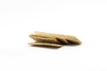A pile of dry wheat light thin slices of dry diet bread on a white background Royalty Free Stock Photo