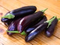 Pile of eggplants on a wooden table