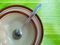 pile of empty plates and bowls with spoons Royalty Free Stock Photo