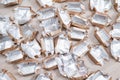 Pile of empty silver-gold candy wrappers. Top view. Royalty Free Stock Photo