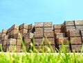 Pile of empty wooden crates and green grass outdoors Royalty Free Stock Photo