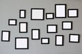 Pile of empty wooden picture frames on wall Royalty Free Stock Photo