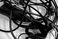 A pile of entangled cords in black and white