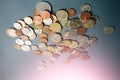 Pile of euro cent coins and dimes lying on the grey background. Money finance economic concept Royalty Free Stock Photo