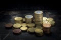 Pile of euro coins with high contrast and ighting seen from above with a black background Royalty Free Stock Photo