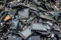 pile of ewaste with visible broken screens