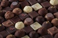 A pile of exquisite and beautiful chocolate cubes full of pictures