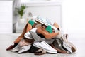 Pile of female shoes on floor Royalty Free Stock Photo