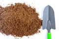 Pile of fertile soil on a white background. Garden tools Royalty Free Stock Photo