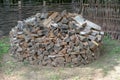 A pile of firewood for the fireplace. Preparation of firewood for the winter