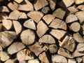 Pile of firewood. Stack of chopped tree logs nature background texture. Firewood stacked. Chipped organic firewood