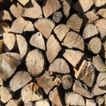 Pile of firewood. Stack of chopped tree logs nature background texture. Firewood stacked. Chipped organic firewood