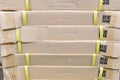 Pile of flat cardboard boxes with yellow tape Royalty Free Stock Photo