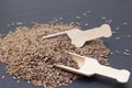 Pile of flax or flax seeds in a wooden spoon