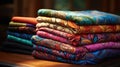 Pile folded multicolored batik clothes on a tabletop. generative ai