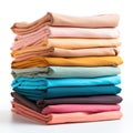 Pile of folded multicolored cotton t-shirts in a factory shop, different colors