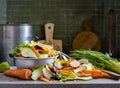 A pile of food waste, vegetable peels, on the kitchen table, composting of organic kitchen waste