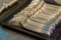 Pile of fork on a tray prepare for event or party