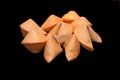 A pile of fortune cookies on black background Royalty Free Stock Photo