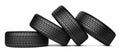 Pile of four black wheel tyres for car