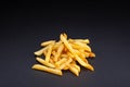 Pile of french fries over black background